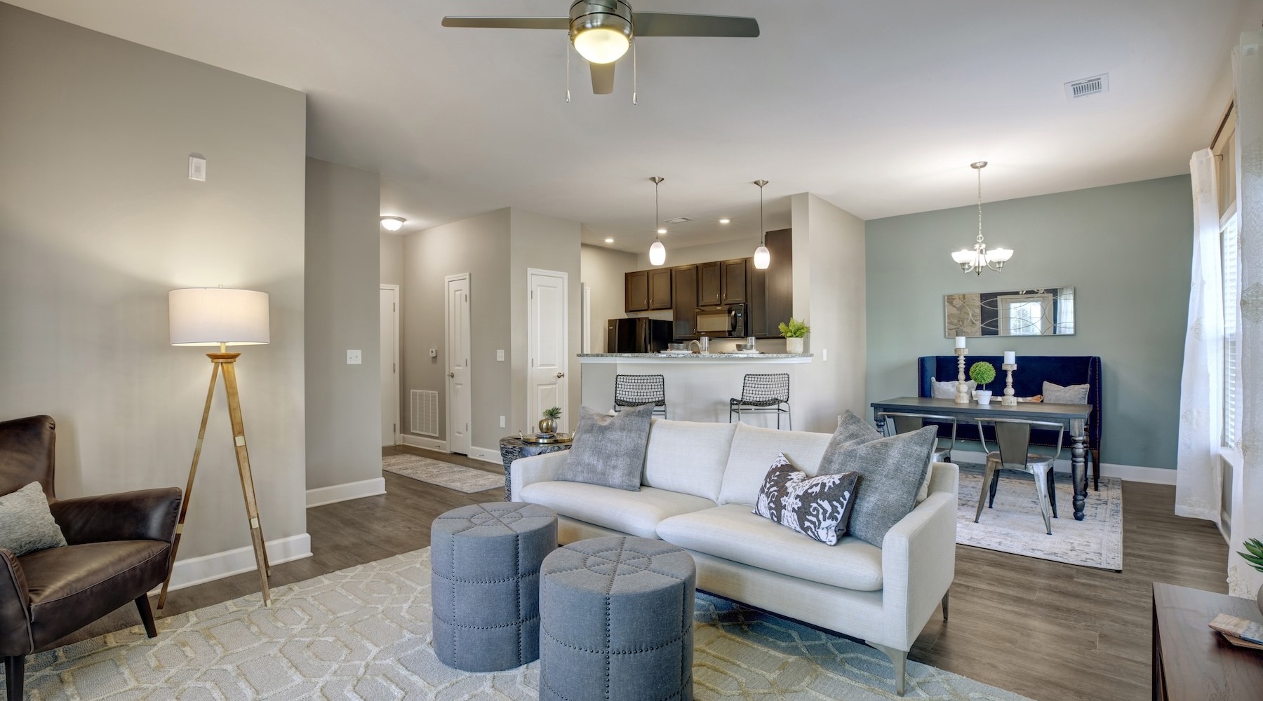 living room with seating ceiling fan and dining room 