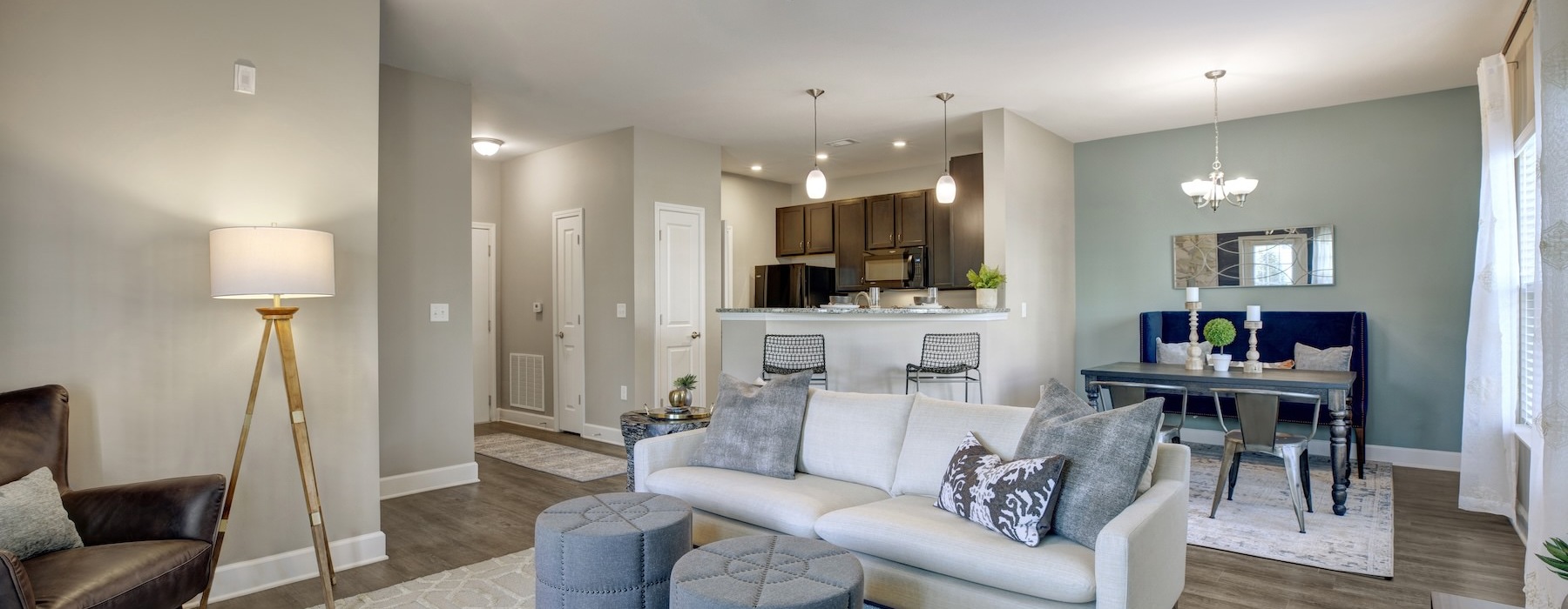 living room with seating ceiling fan and dining room 