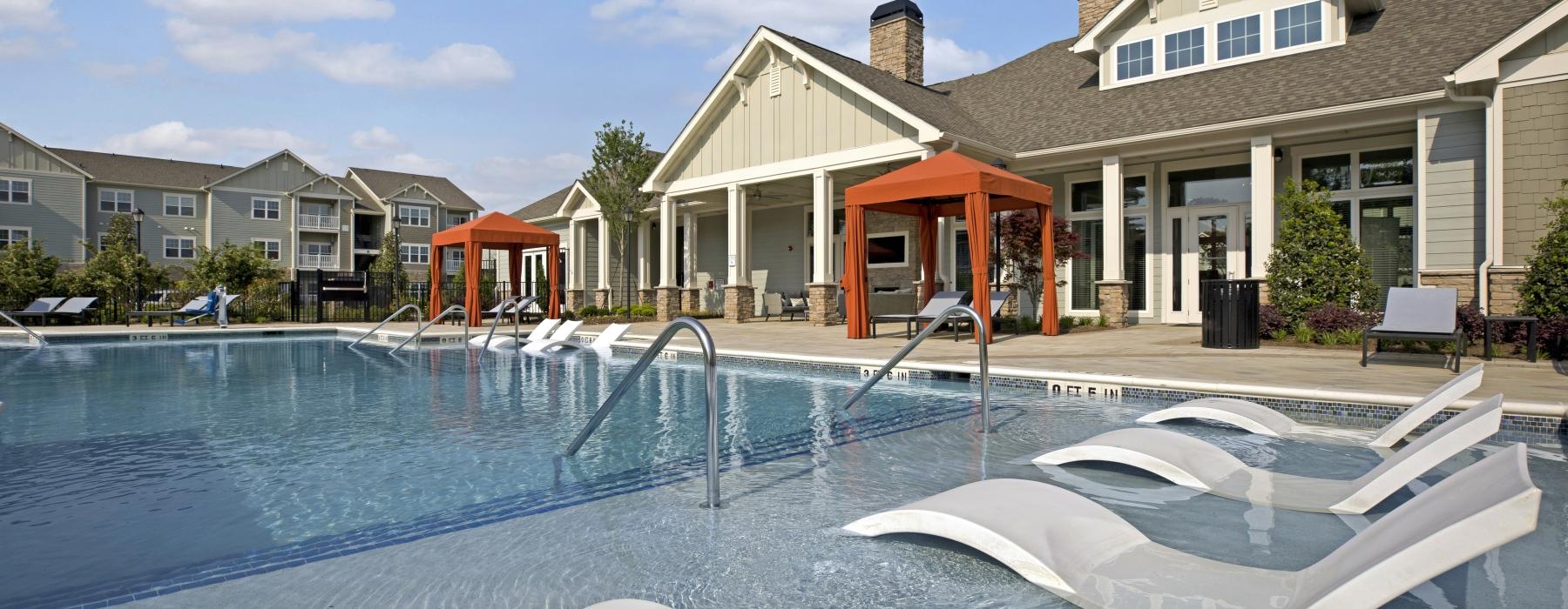 a swimming pool in front of a house